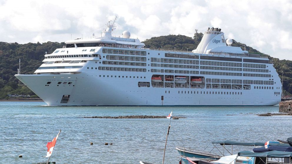 PHOTO: The "Seven Seas Mariner" cruise ship traveling from Florida passes through the Panama Canal after it was barred from docking by local authorities in Cartagena, Colombia, due to COVID-19 infections on board, near Panama City, Dec. 23, 2021.