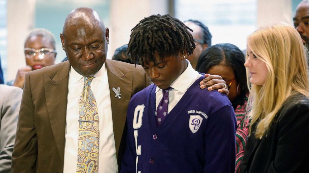 PHOTO: Civil Rights attorney Ben Crump stands with Elijah Edwards, 14, a student at Sail High School during a "Stop The Black Attack" rally against ongoing state legislation at the Florida State Capitol building in Tallahassee, Fla., Jan. 25, 2023.