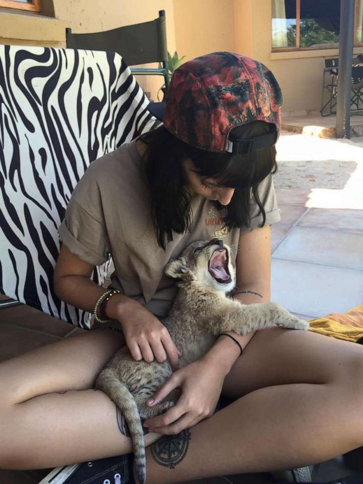 PHOTO: Beth Jennings holds a cub at a lion park in South Africa in February 2015.