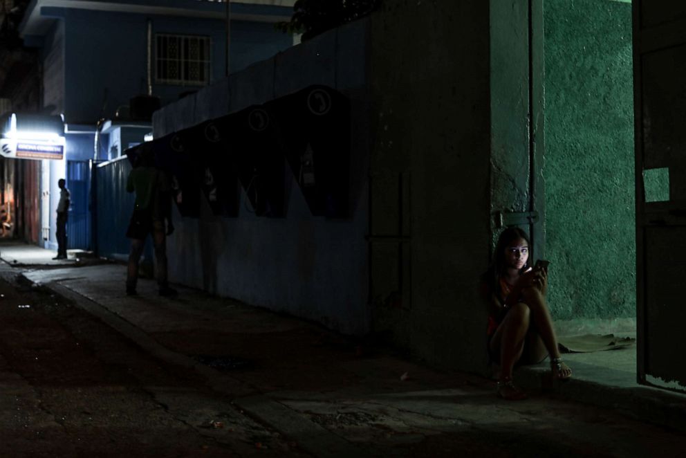 PHOTO: A young woman uses her smartphone on July 13, 2019, in Havana, Cuba. The Cuban government began giving 3G mobile internet access to its citizens in 2018.