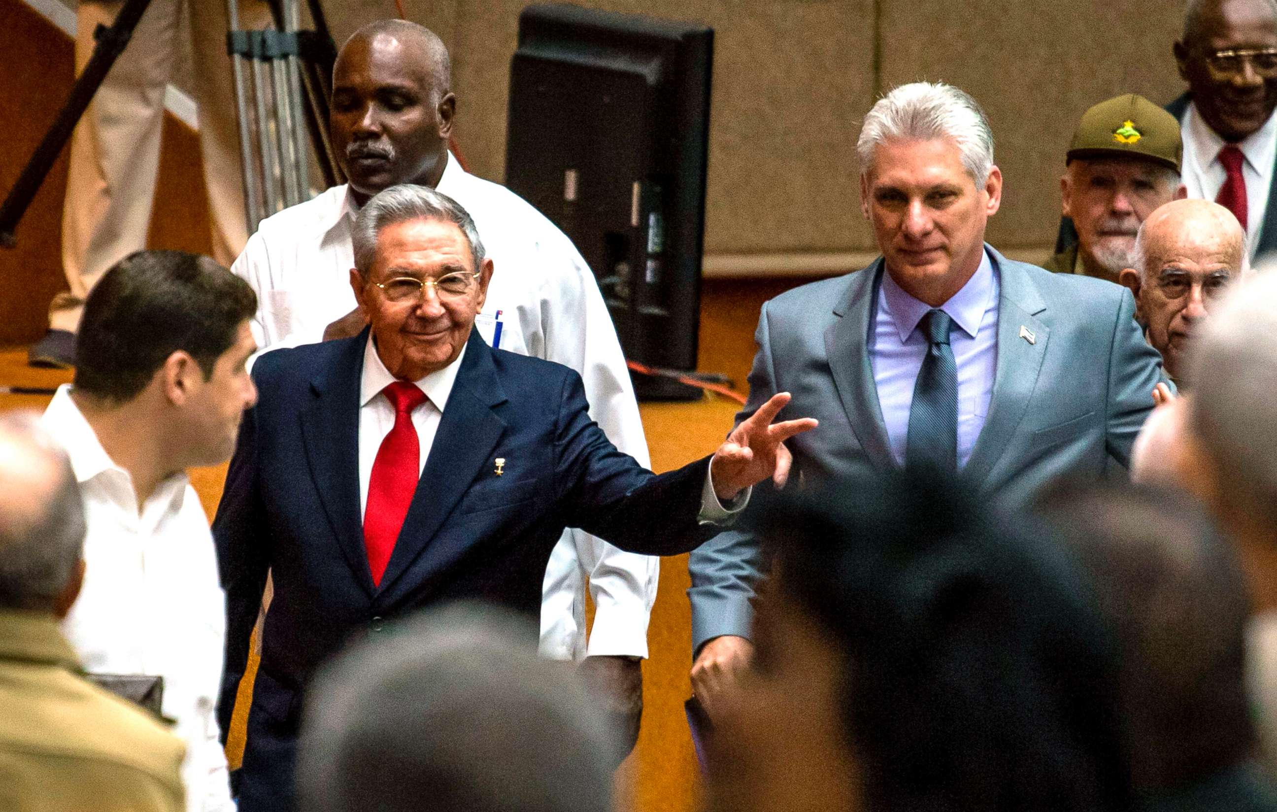 PHOTO: Cuban President Raul Castro (L) and First Vice-President Miguel Diaz-Canel (C) arrive for a National Assembly session that named the latter as the candidate to succeed Castro as president, in Havana, April 18, 2018.
