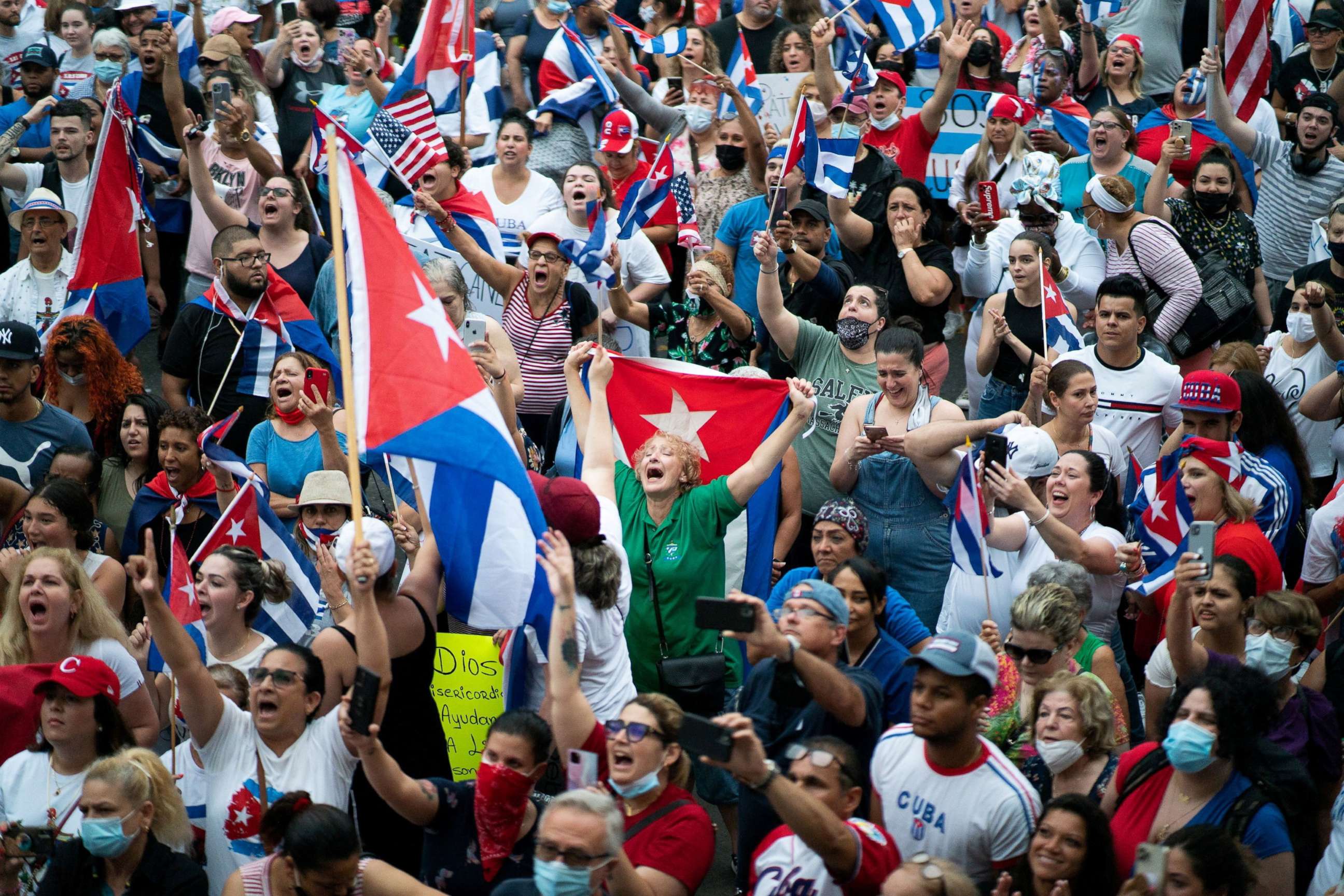 PHOTO: Members of an exiled Cuban community react to reports of protests in Cuba, against the deteriorating economy, in North Bergen, N.J, July 13, 2021. 