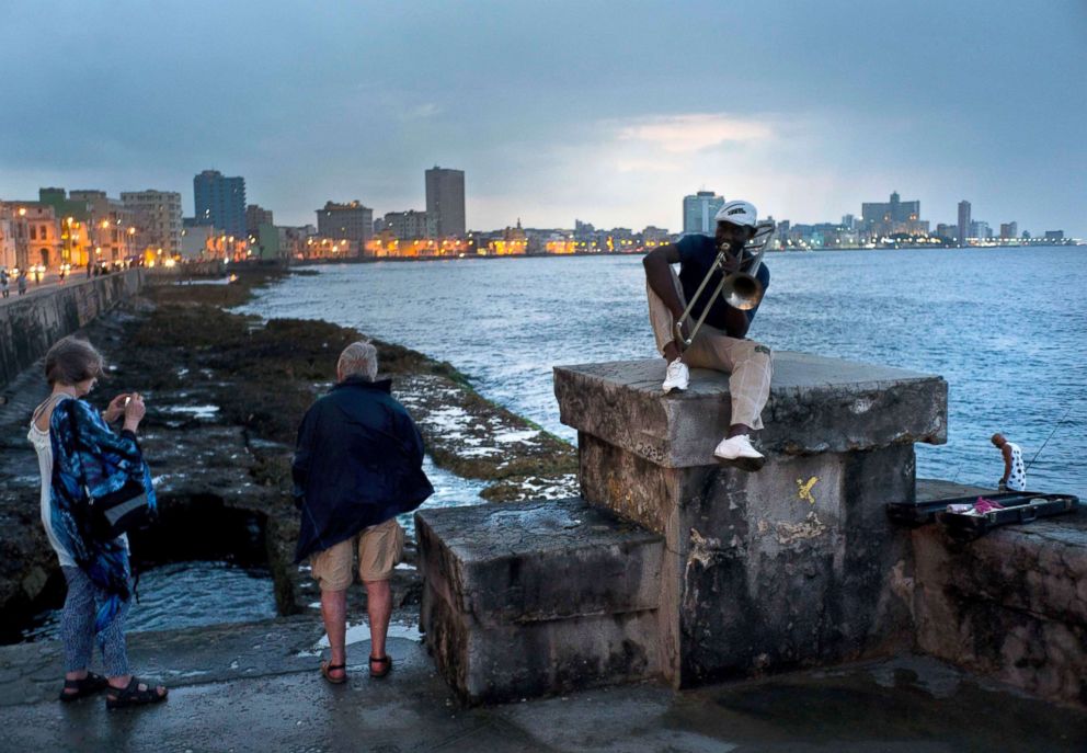 PHOTO: Musician Lazaro Martinez plays his trombone on the Malecon sea wall in Havana, Cuba, April 13, 2018.