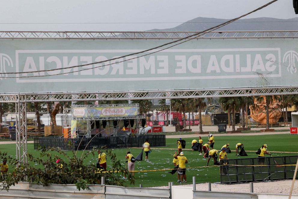PHOTO: Staff members clean the venue of Medusa Festival, an electronic music festival, after high winds caused part of a stage to collapse, in Cullera, near Valencia, Spain, Aug. 13, 2022.