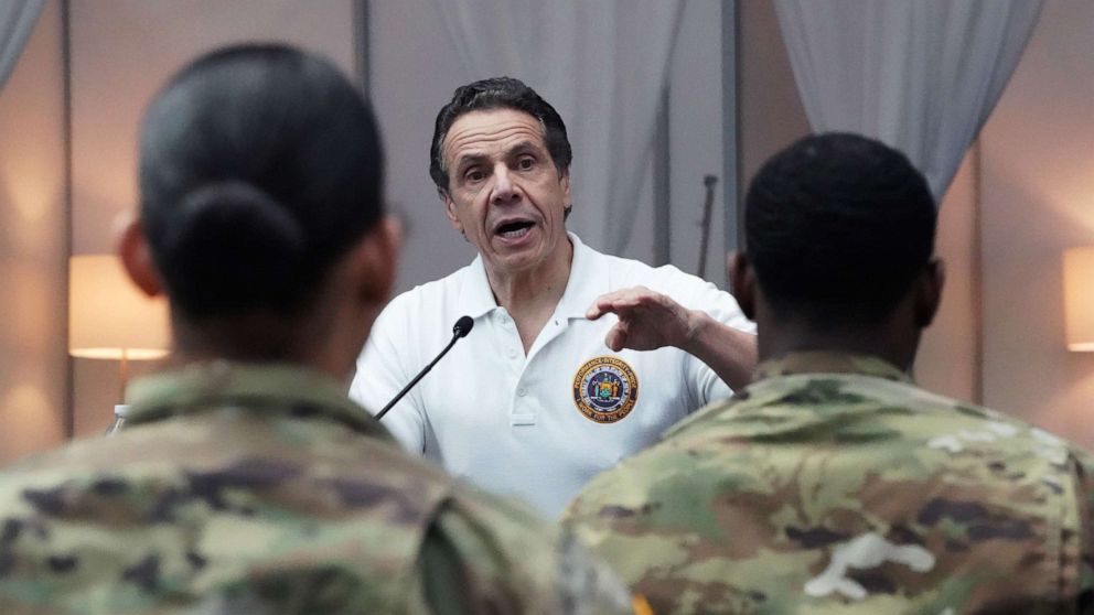 PHOTO: National Guard troops listen as New York Governor Andrew Cuomo speaks to the press at the Jacob K. Javits Convention Center in New York, March 27, 2020. 