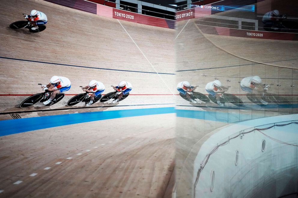 PHOTO: Members of the French women's track cycling team round the track during a training session inside the Izu velodrome at the 2020 Summer Olympics, Saturday, July 31, 2021, in Izu, Japan.