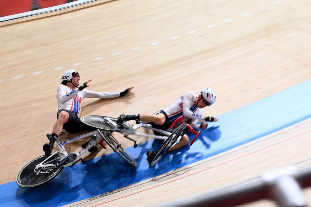 PHOTO: Adrian Hegyvary and Gavin Hoover of the United States crash in the men's track cycling madison final during the Tokyo 2020 Olympic Games at Izu Velodrome in Izu, Japan, on Aug. 7, 2021.