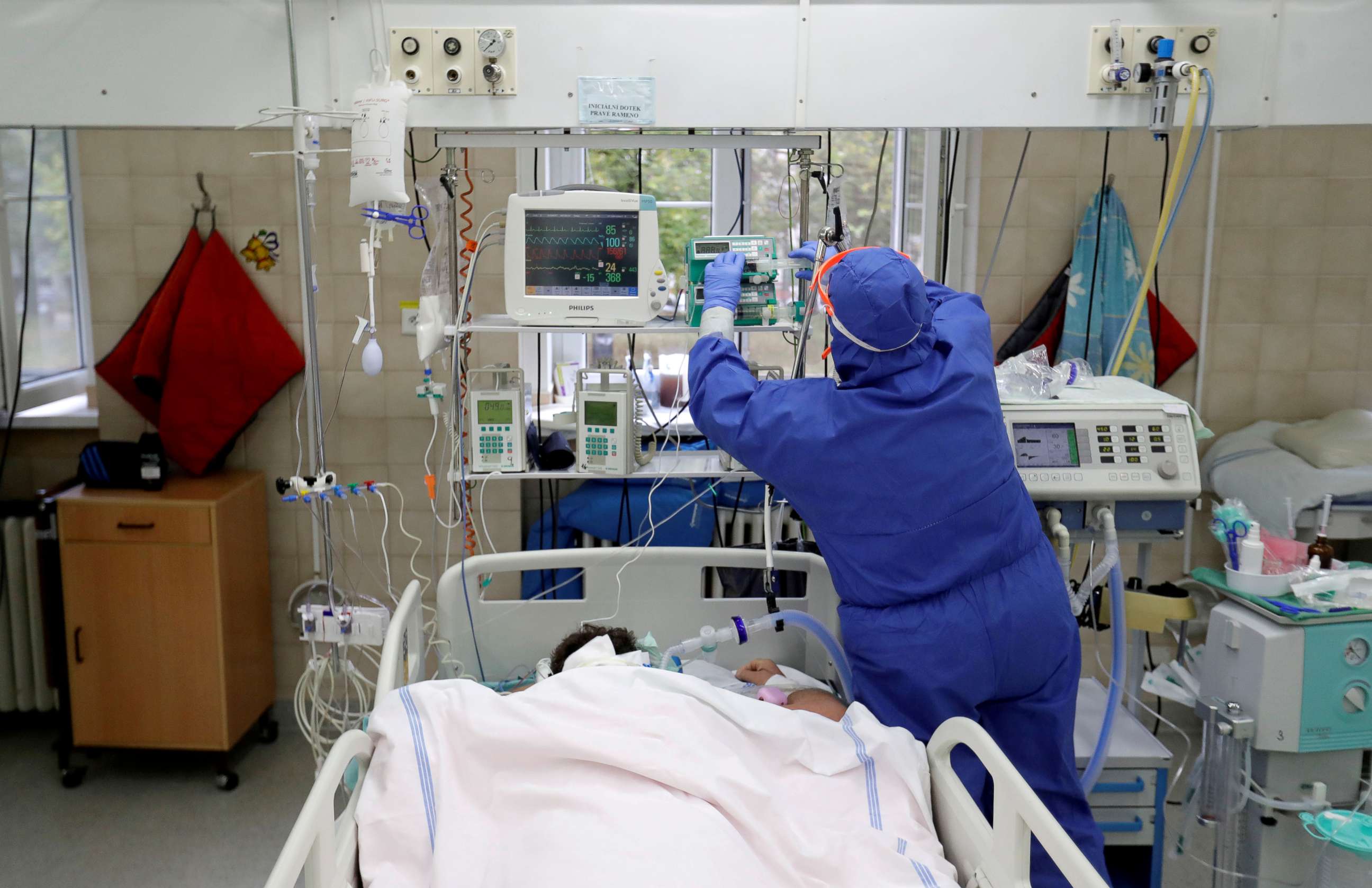 PHOTO: A member of the medical staff treats a patient suffering from COVID-19 at the intensive care unit of the Slany Hospital in Slany, Czech Republic, Oct. 13, 2020. 