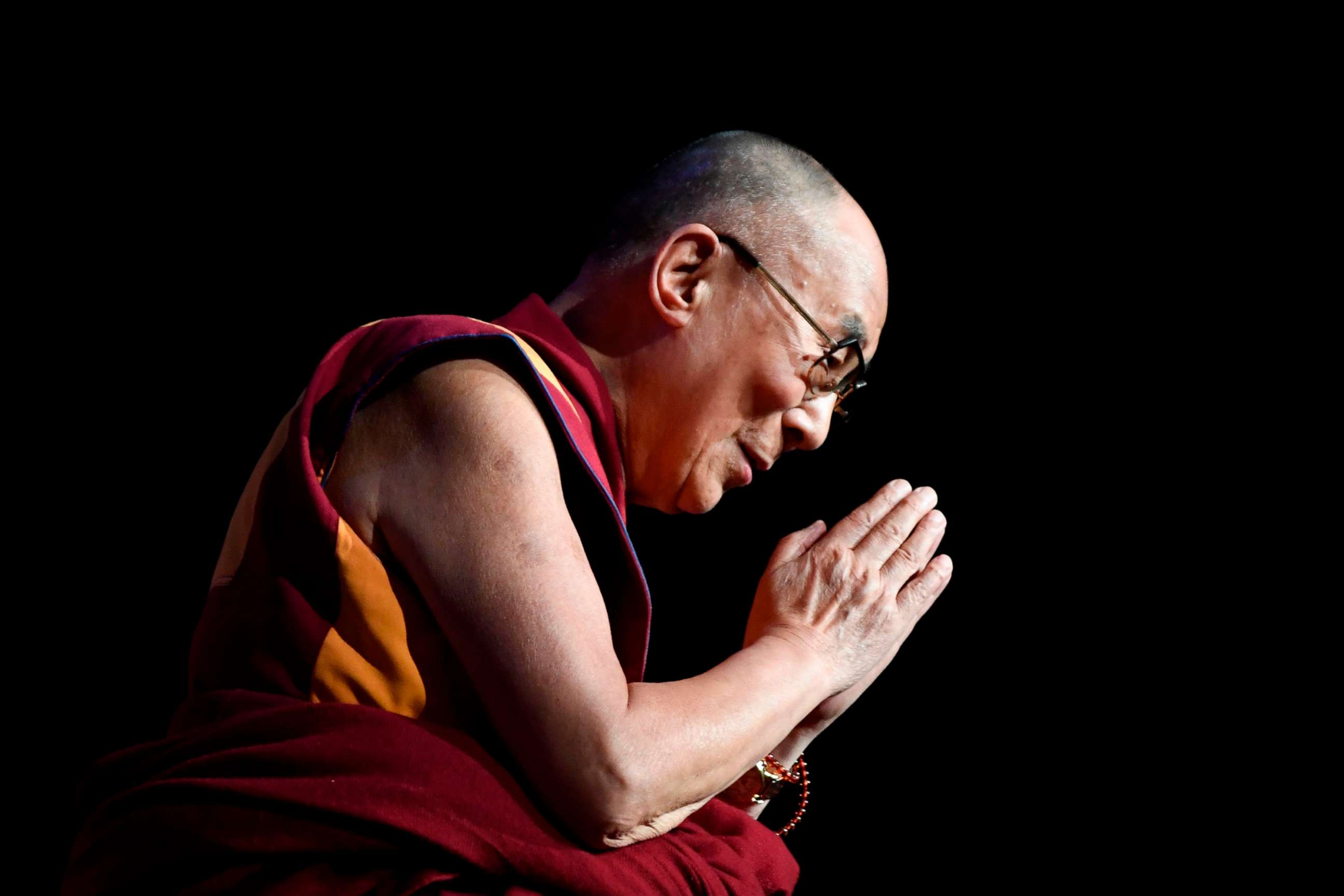 PHOTO: In this file photo taken on Sept 13, 2016 the Dalai Lama gestures during a group hearing at the Palais des Congres, in Paris.