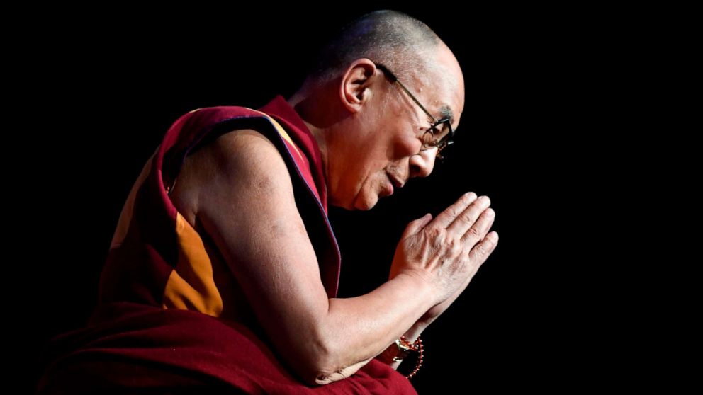 In this file photo taken on Sept 13, 2016 the Dalai Lama gestures during a group hearing at the Palais des Congres, in Paris.