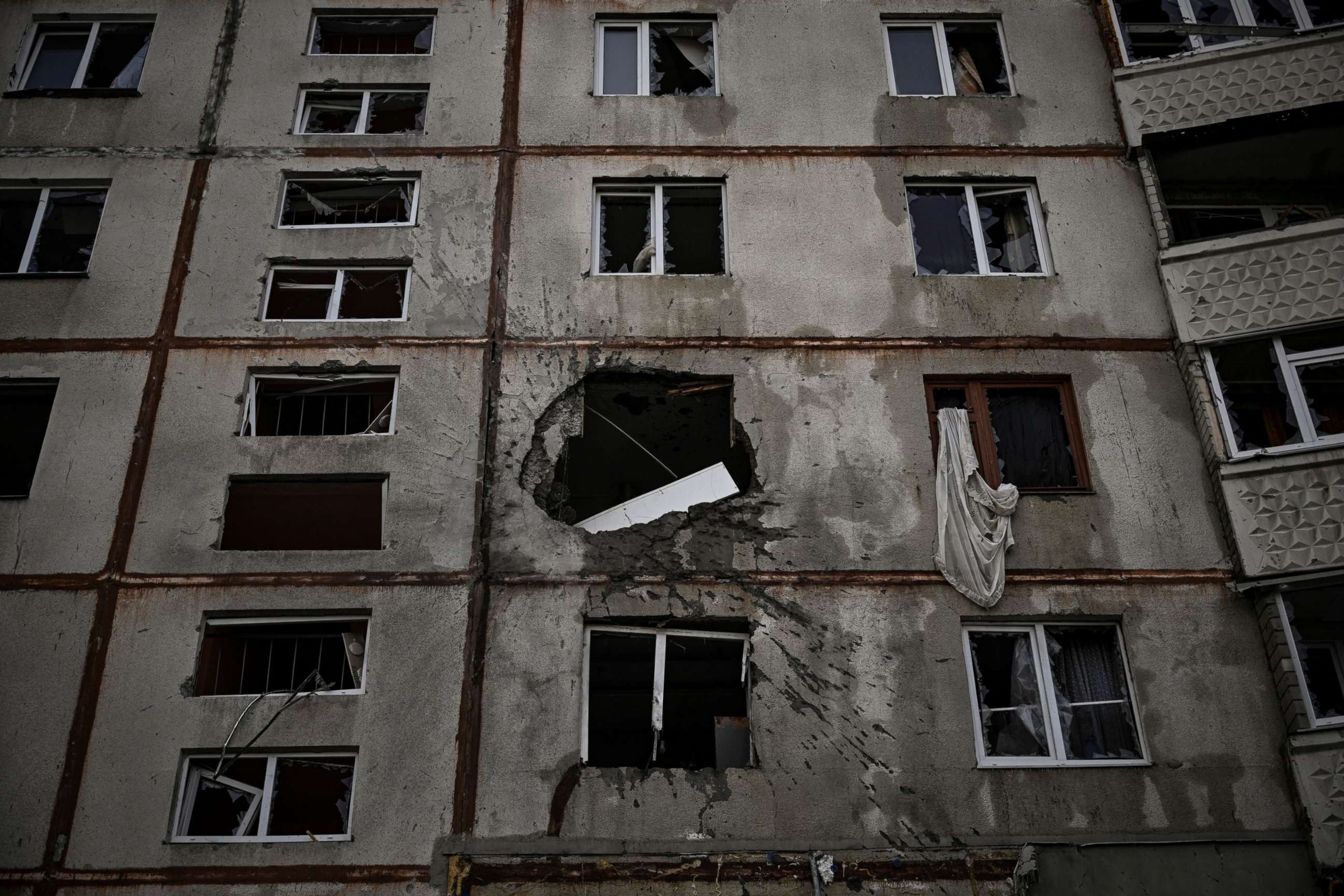 PHOTO: A heavily damaged apartment building is pictured at a front line discrict of Kharkiv, Ukraine, on March 27, 2022, amid the Russian invasion.