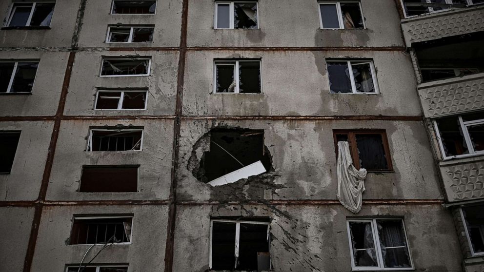 PHOTO: A heavily damaged apartment building is pictured at a front line discrict of Kharkiv, Ukraine, on March 27, 2022, amid the Russian invasion.