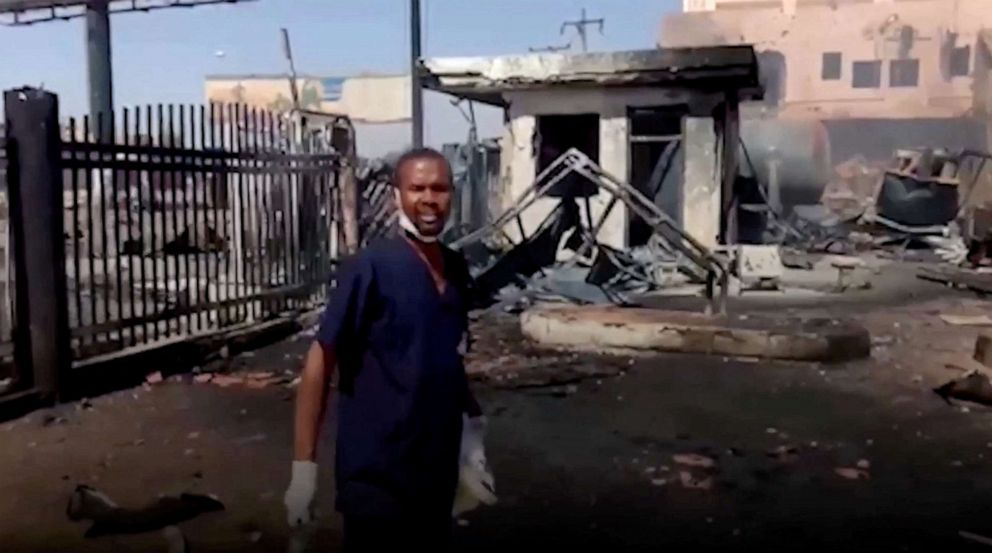 PHOTO: A doctor points at the damage outside the East Nile Hospital in Khartoum, Sudan, in this screen grab taken from a social media video released on May 15, 2023.
