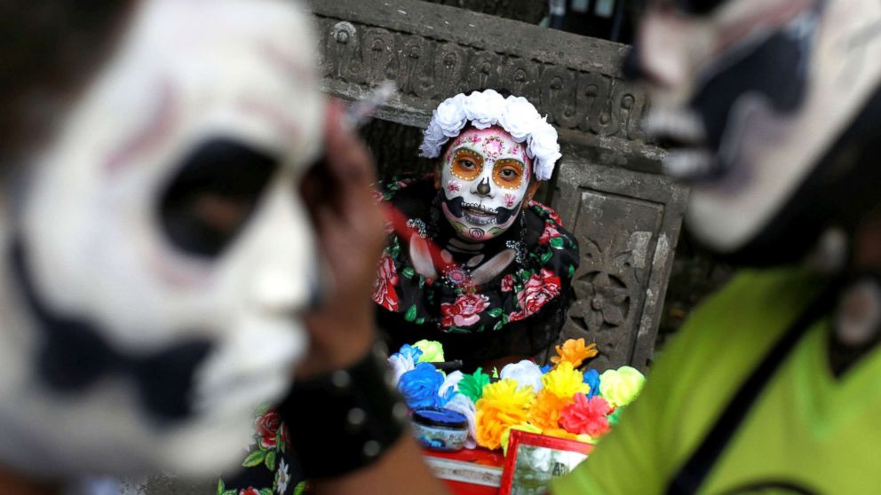 A woman dressed up as "Catrina," a Mexican character also known as "The Elegant Death," takes part in a Catrinas parade in Mexico City, Oct. 22, 2017. 