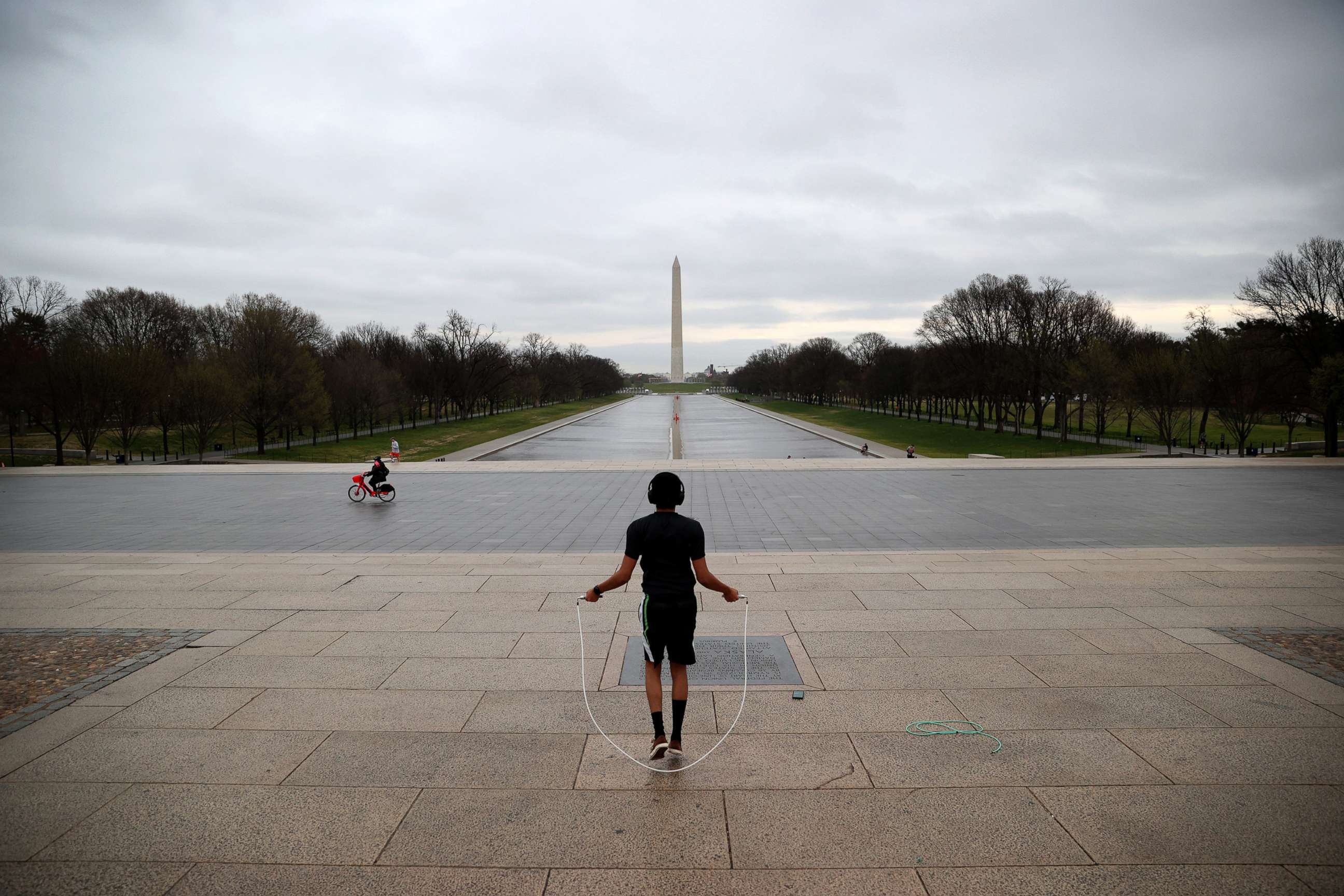 PHOTO: Zef Talahun jumps rope on the plaza in front of the Lincoln Memorial, normally filled with tourists, but now nearly empty due to the impacts of coronavirus (COVID-19) on March 17, 2020 in Washington, D.C.
