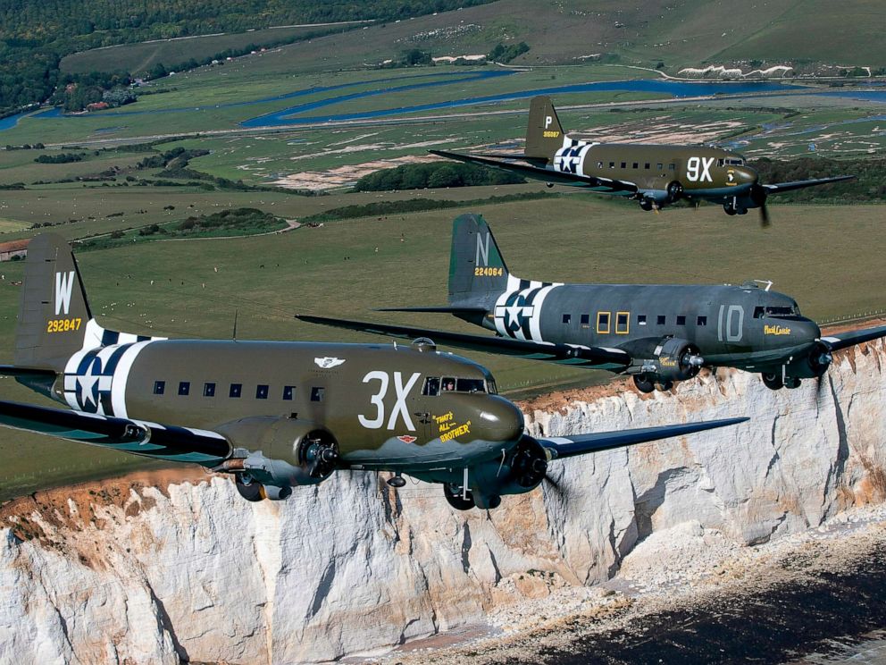 PHOTO: Daks, including "That's All, Brother," fly over Normandy during event preparation at Beachy Head in southern England.