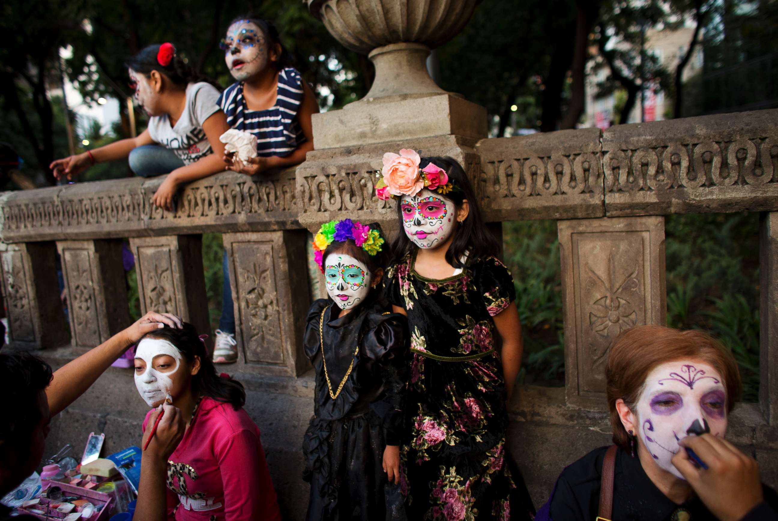 PHOTO: People have their faces painted in the style of Mexico's iconic "Catrina," as they prepare to march in the Grand Procession of the Catrinas, part of upcoming Day of the Dead celebrations in Mexico City, Oct. 22, 2017.