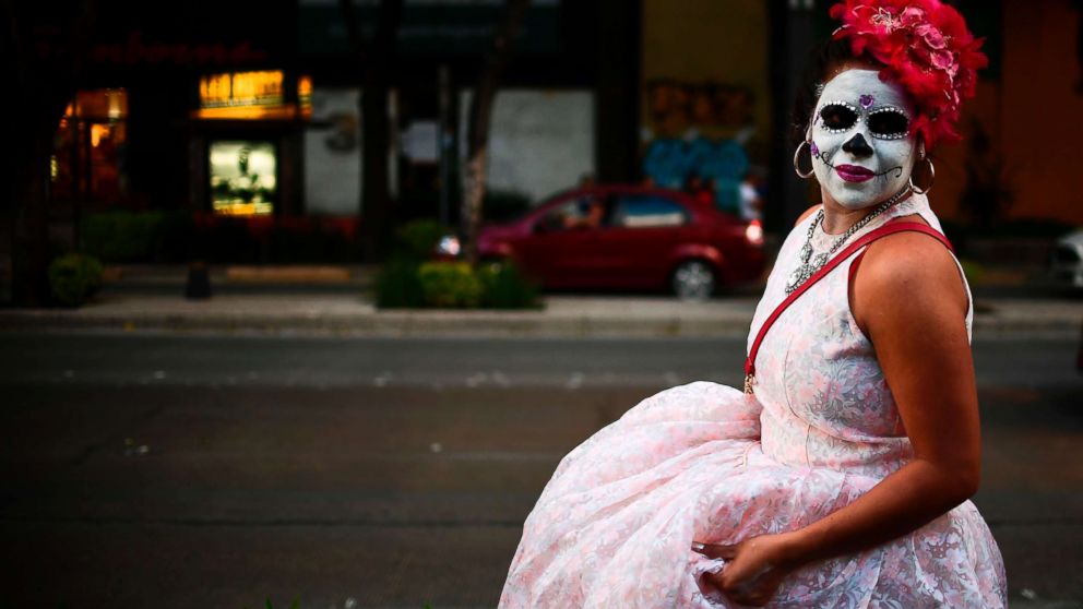 PHOTO: A person fancy dressed as "Catrina" takes part in the "Catrinas Parade" along Reforma Avenue, in Mexico City, Oct. 22, 2017. 