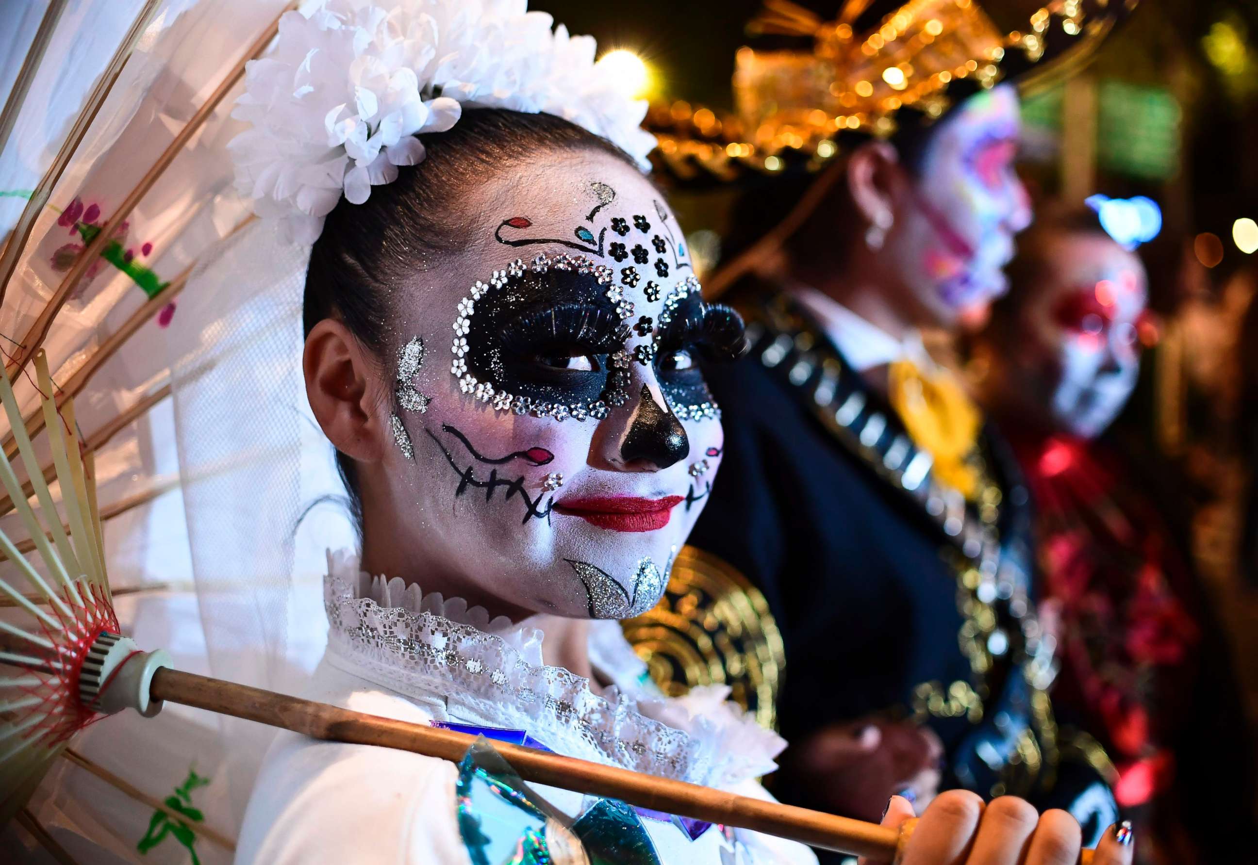 PHOTO: People fancy dressed as "Catrina" take part in the "Catrinas Parade" along Reforma Avenue, in Mexico City, Oct. 22, 2017. 