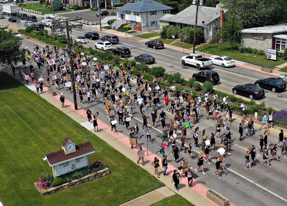 PHOTO: Demonstrators march in support of the Black Lives Matter Movement, on June 06, 2020, in Deer Park, New York.