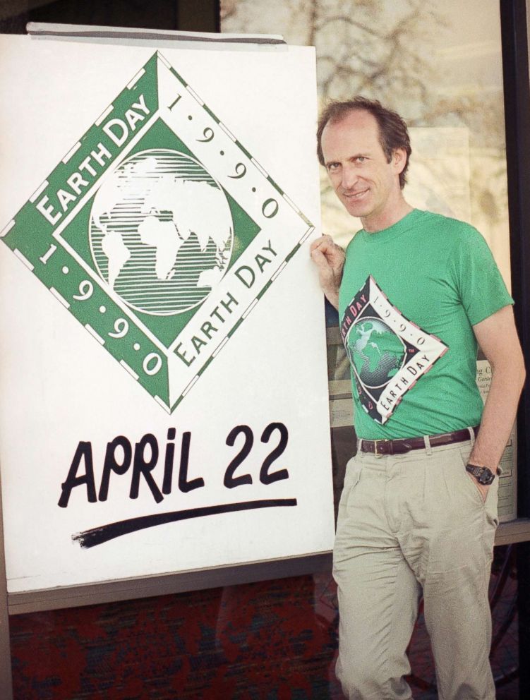 PHOTO: Earth Day founder Denis Hayes poses with an Earth Day sign outside Earth Day headquarters in Palo Alto, Calif., on April 21, 1990, in this file photo. Earth Day is set for April 22 with environmental activities planned throughout the world.