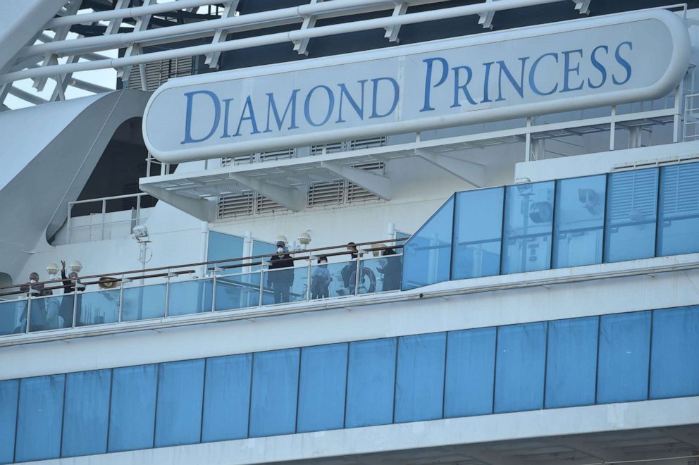 PHOTO: Passengers are seen on the deck of the Diamond Princess cruise ship, with thousands of people quarantined on board due to fears of the new coronavirus, at the Daikaku Pier Cruise Terminal in Yokohama, Japan, Feb. 13, 2020.