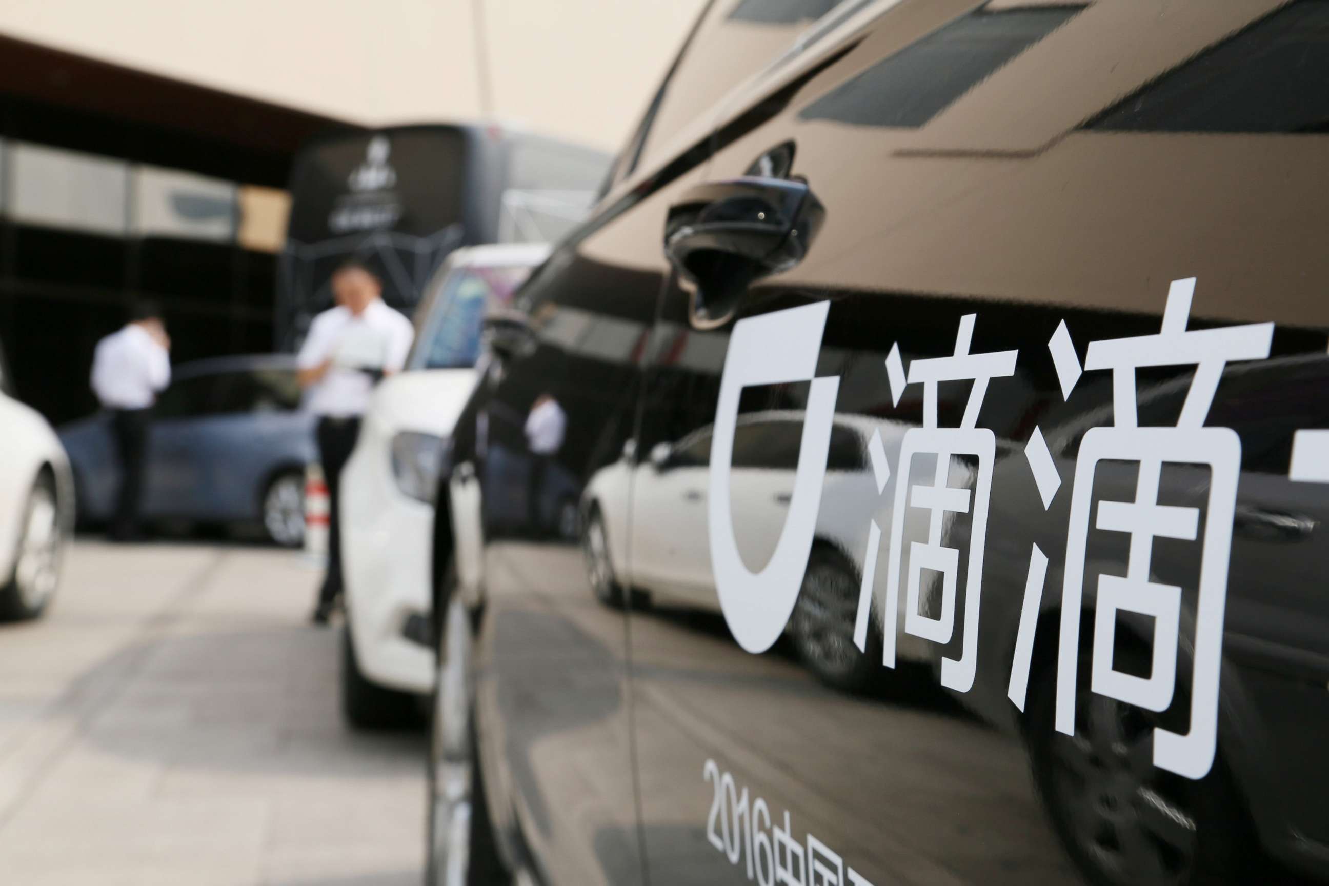 PHOTO: A Didi sign is seen on a car during the China Internet Conference in Beijing, China in this file photo, June 21, 2016.