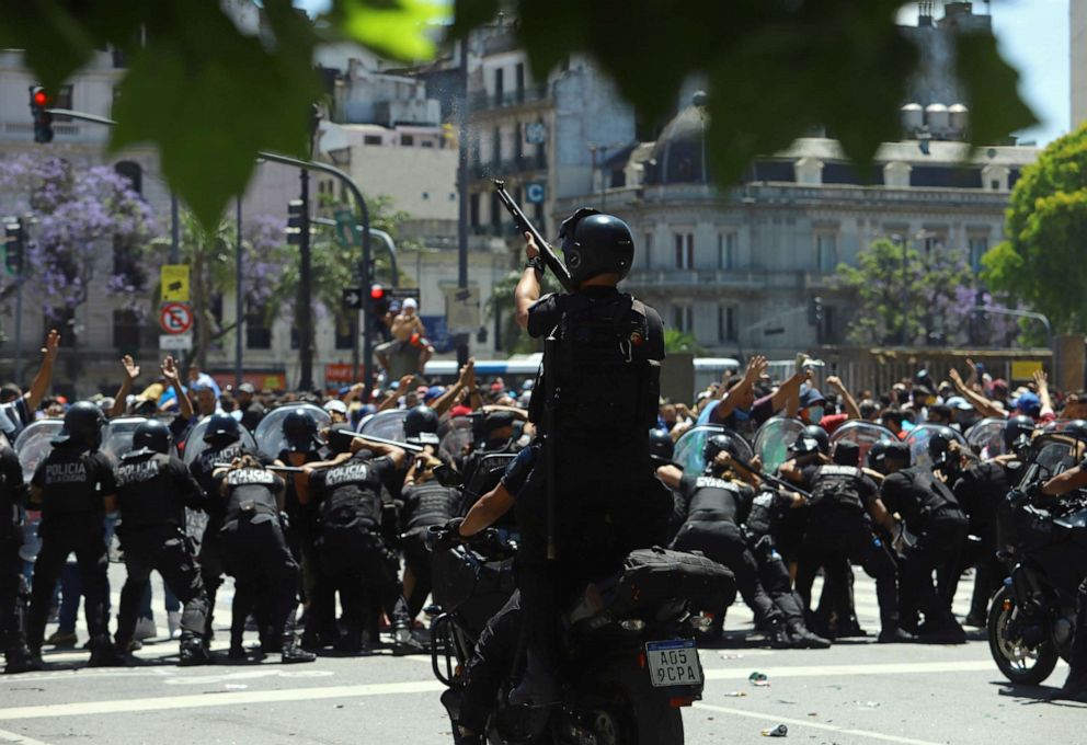 PHOTO: Police push people back during clashes, as authorities move to shut down access to the wake of soccer legend Diego Maradona, in Buenos Aires, Argentina, Nov. 26, 2020.