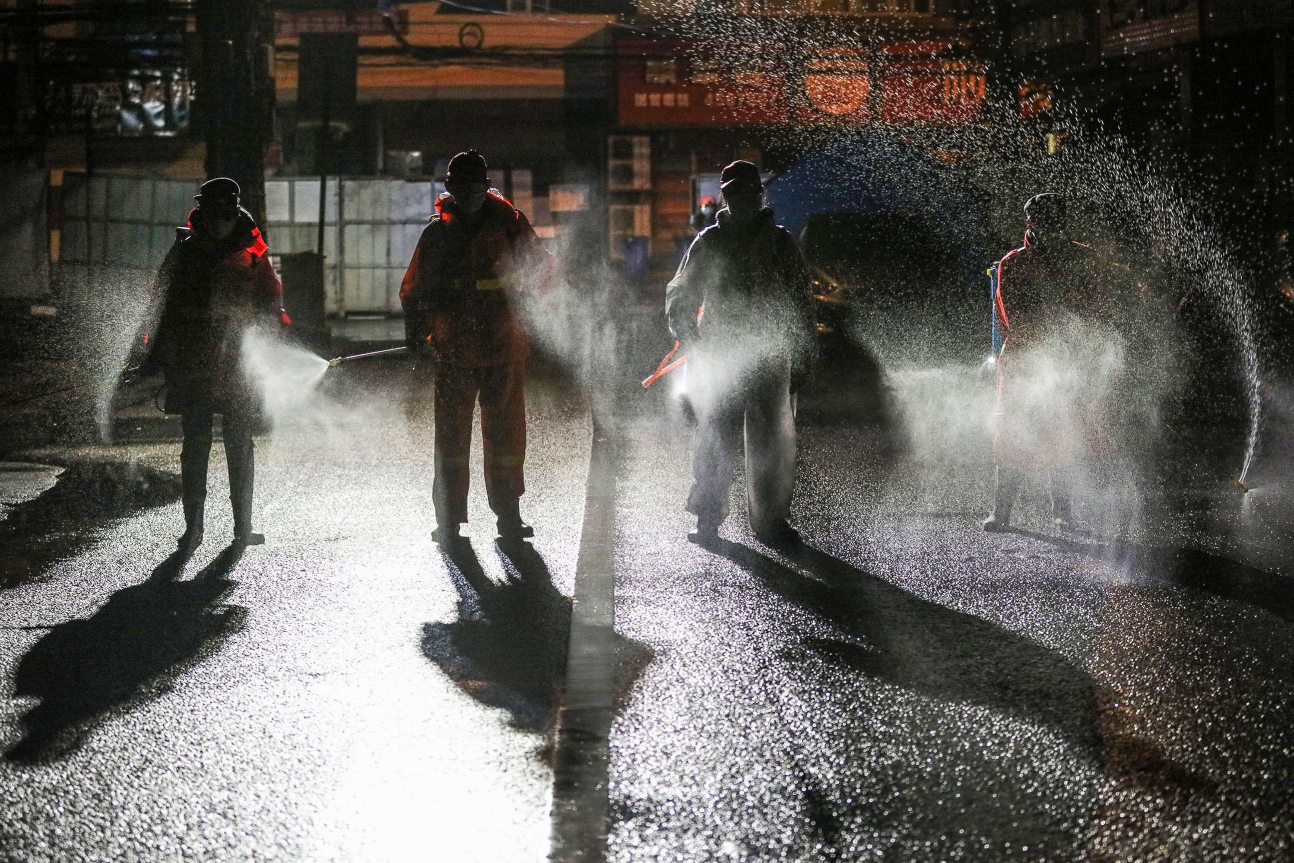 PHOTO: This photo taken on March 2, 2020, shows workers spraying disinfectant on a road in Yunmeng county, Xiaogan city, in China's central Hubei province.