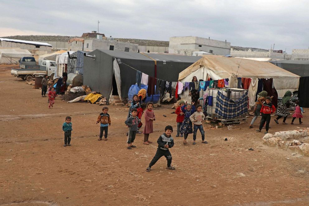 PHOTO: Displaced Syrian children play at an informal camp in Kafr Lusin village, on the bored with Turkey, in Idlib, Syria, Feb. 21, 2020.