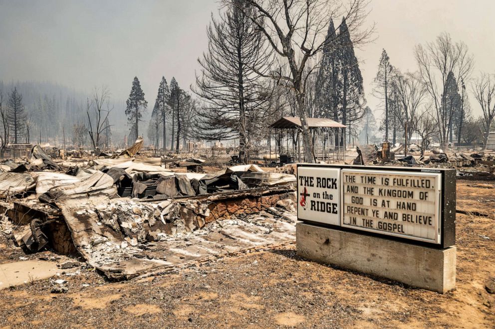PHOTO: A church marquee stands among buildings destroyed by the Dixie Fire in Greenville, Aug. 5, 2021, in Plumas County, Calif.