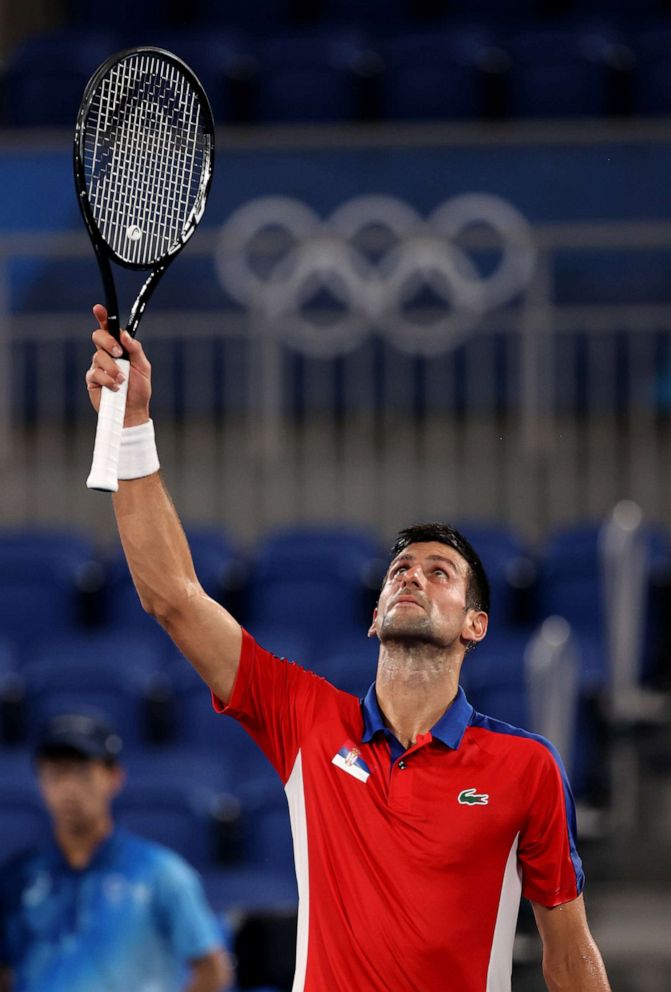 PHOTO: Novak Djokovic of Team Serbia celebrates victory after his Men's Singles Quarterfinal match against Kei Nishikori of Team Japan on day six of the Tokyo 2020 Olympic Games at Ariake Tennis Park on July 29, 2021 in Tokyo, Japan.