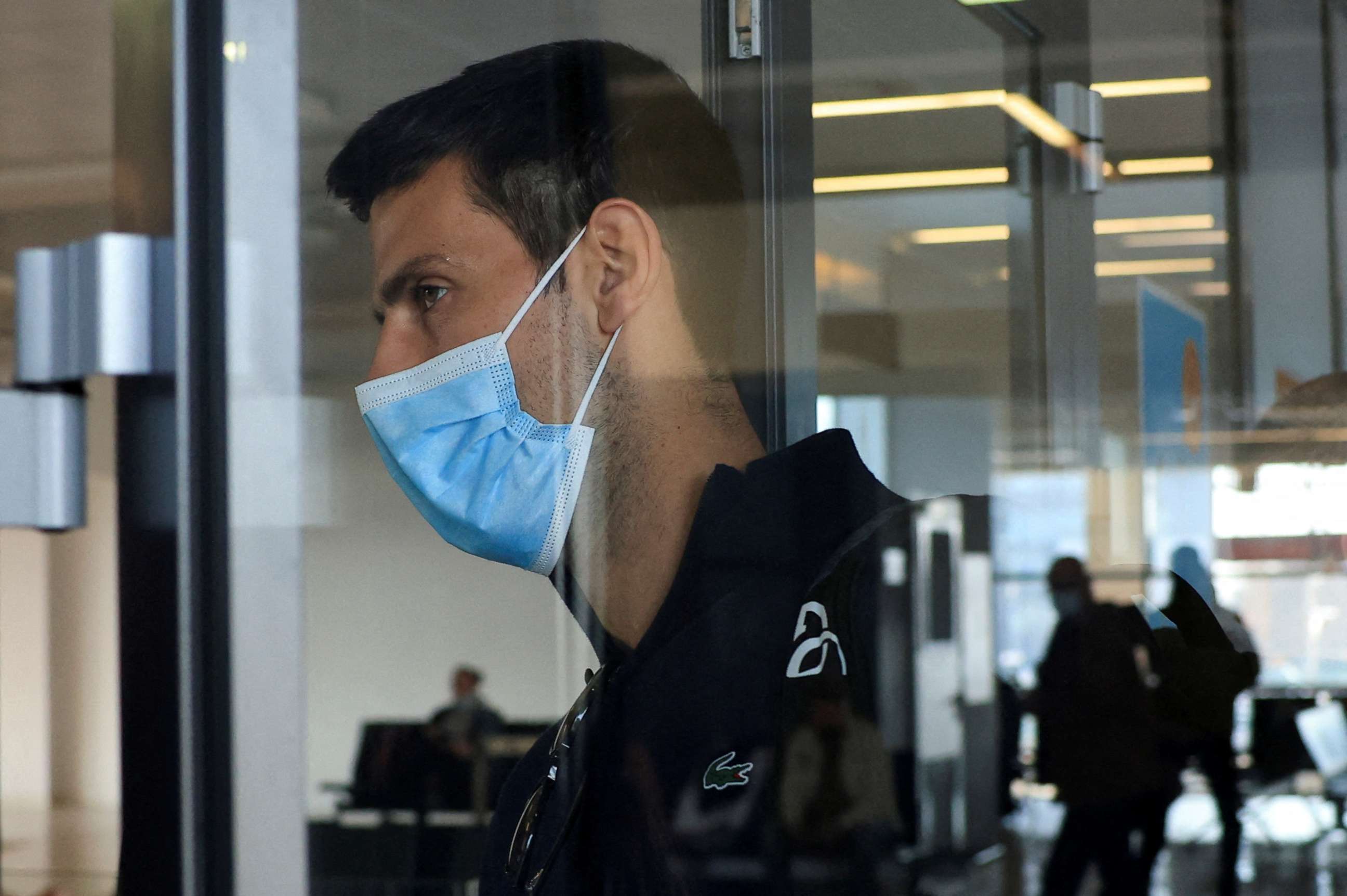 PHOTO: Novak Djokovic arrives at Nikola Tesla Airport in Belgrade, Serbia, Jan. 17, 2022, after the Australian Federal Court upheld a government decision to cancel his visa to play in the Australian Open.