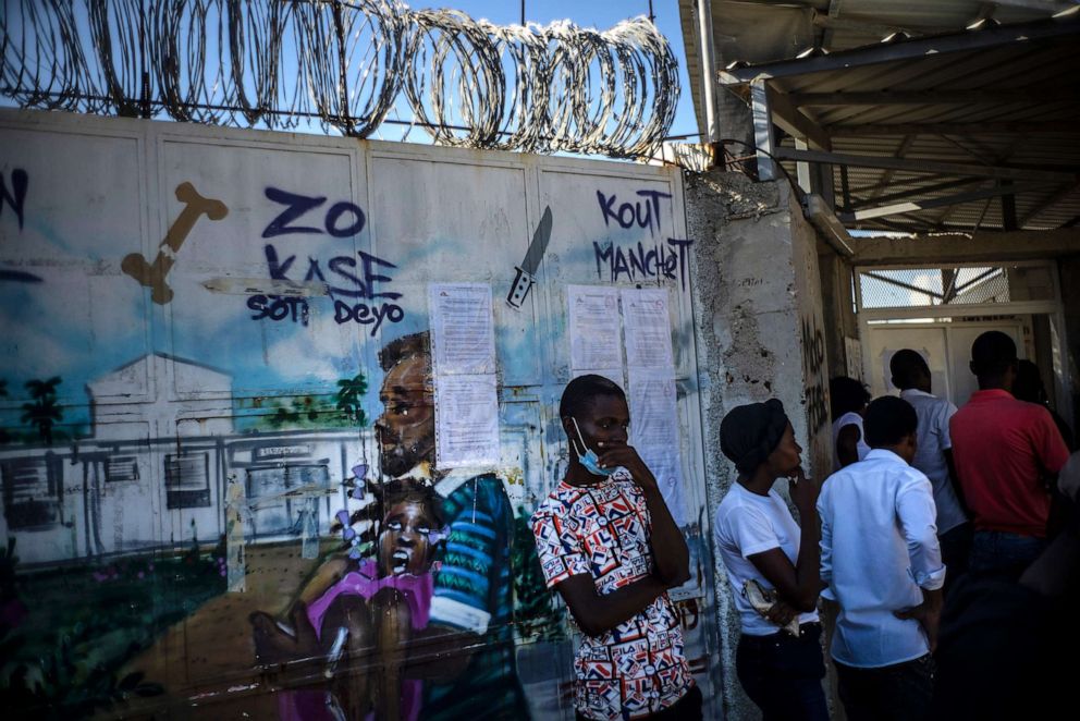 PHOTO: In this Nov. 3, 2022, file photo, people wait at the door to see their relatives at a clinic run by Doctors Without Borders in the Tabarre neighborhood of Port-au-Prince, Haiti.