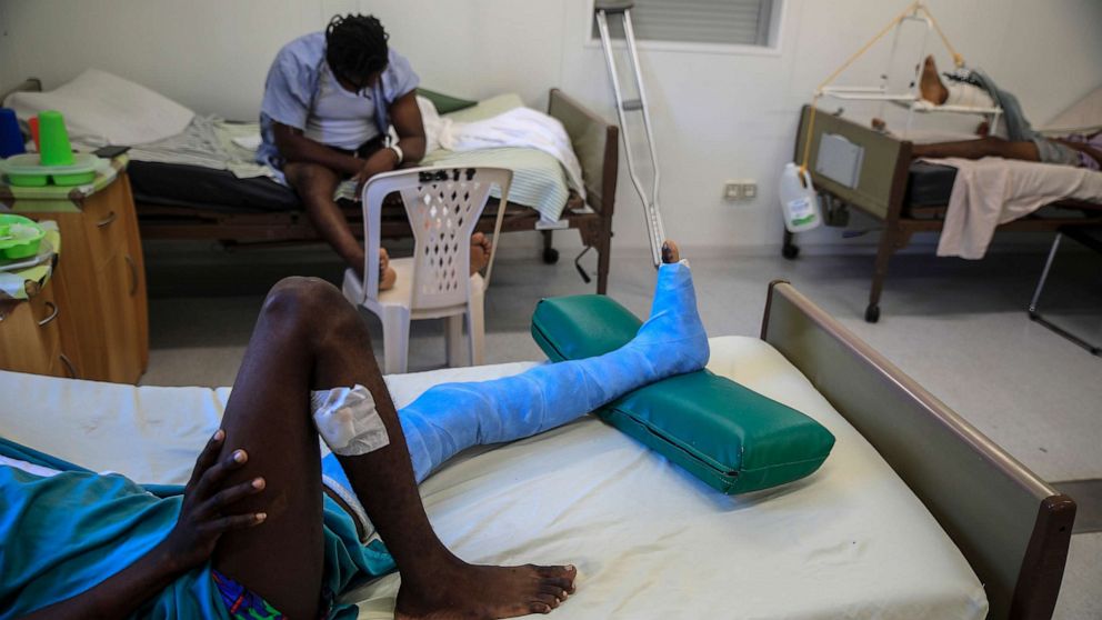 PHOTO: In this Jan. 25, 2023, file photo, a man who was shot in his left foot by a stray bullet, lies on a bed at a clinic run by Doctors Without Borders in the Tabarre neighborhood of Port-au-Prince, Haiti.