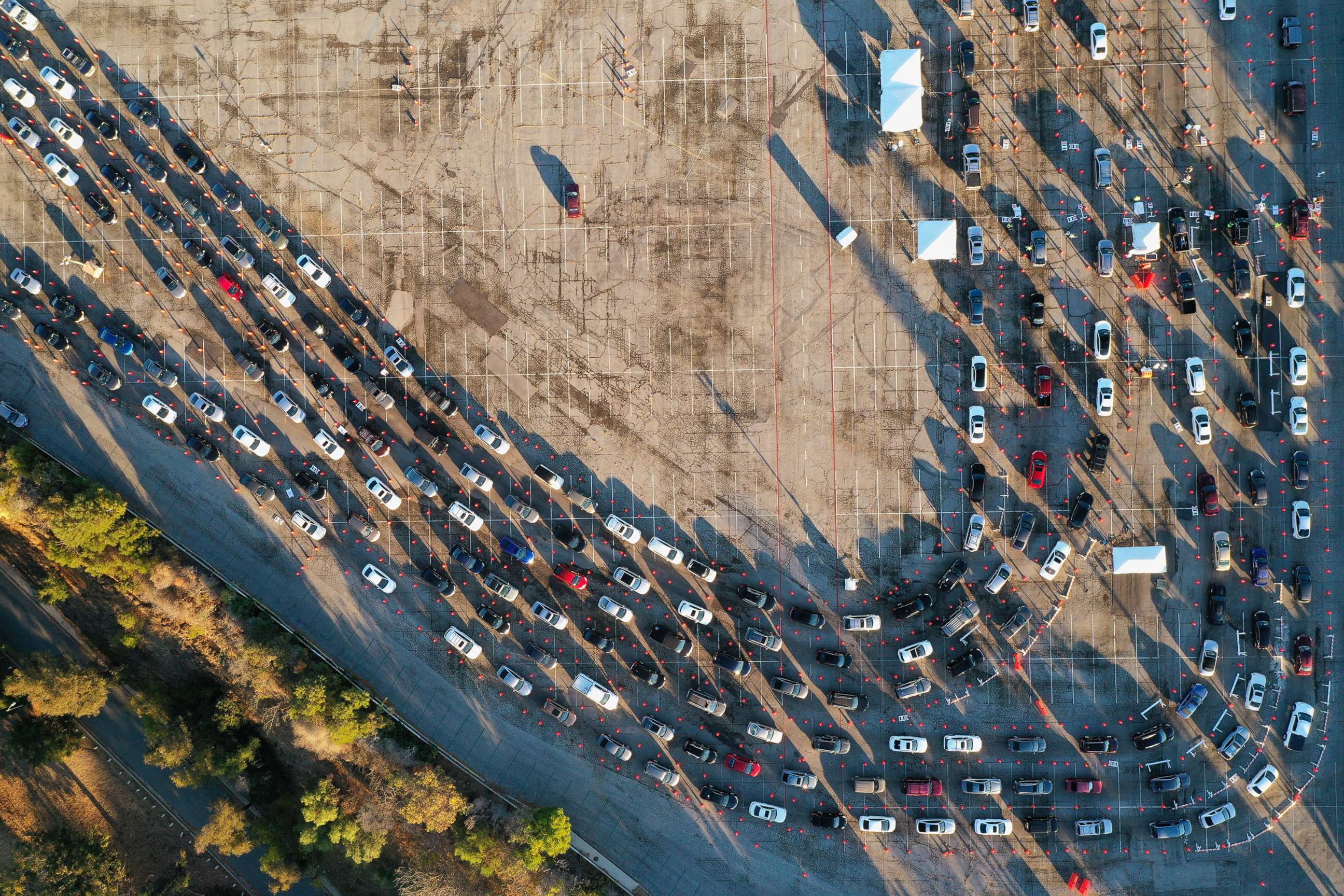 PHOTO: People line up in their vehicles at Dodger Stadium as post-Christmas COVID-19 testing resumes during a surge in positive coronavirus disease cases in Los Angeles,  Dec. 29, 2020.