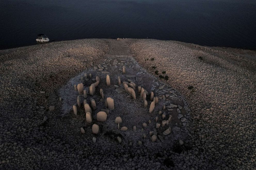 PHOTO: The dolmen of Guadalperal, also known as the Spanish Stonehenge, is revealed due to the receding waters of the Valdecanas reservoir in the outskirts of El Gordo, Spain, Aug, 3, 2022.