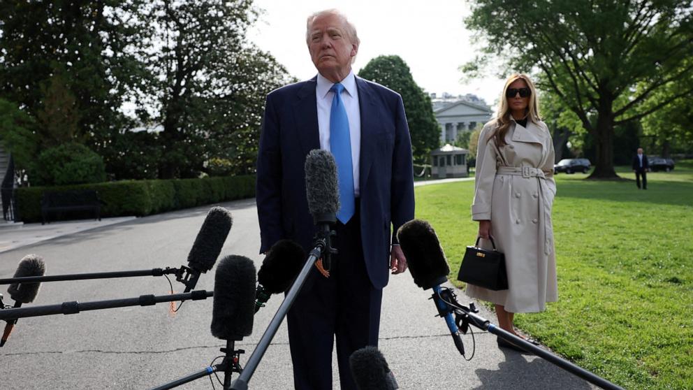 PHOTO: President Donald Trump alongside First Lady Melania Trump, speaks briefly to the media before departing the White House for Rome, where they will attend Pope Francis' funeral, in Washington, April 25, 2025.