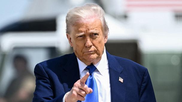 President Donald Trump gestures as he walks to board Air Force One at Joint Base Andrews in Maryland, May 12, 2025.