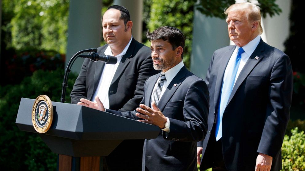 PHOTO: Jonathan Morales, left, and President Donald Trump, look on as Oscar Stewart speaks during a National Day of Prayer event in the Rose Garden of the White House, Thursday, May 2, 2019, in Washington.