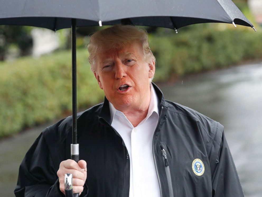 PHOTO: President Donald Trump stops to talk to members of the media in Washington, Oct. 15, 2018, to board Marine One helicopter en route to Florida to tour areas the devastation left behind from Hurricane Michael last week.