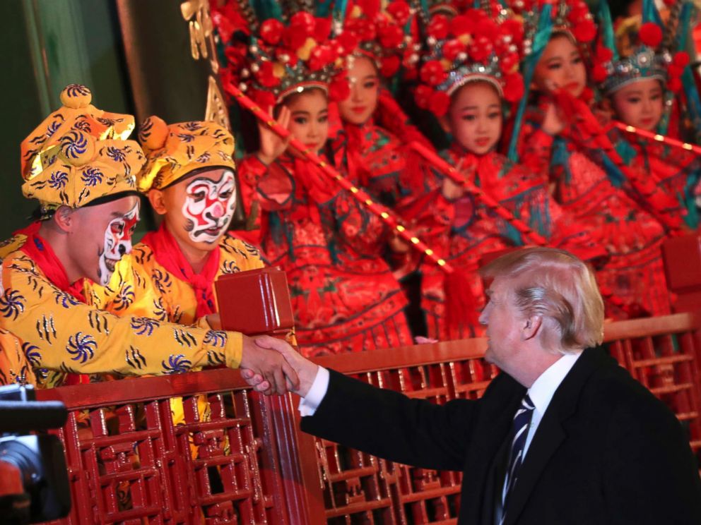 PHOTO: President Donald Trump shakes hands with an opera performer during a tour of an opera performance at the Forbidden City, Nov. 8, 2017, in Beijing, China.