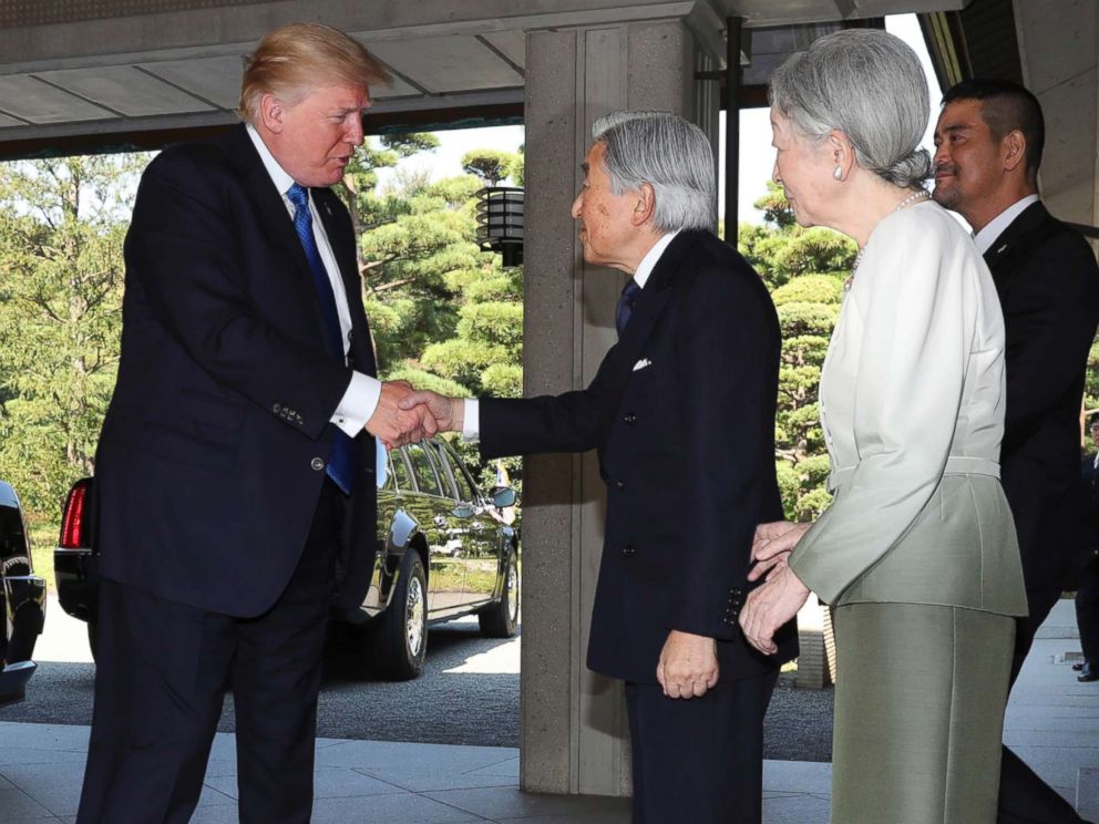 PHOTO: President Donald Trump, left, is greeted by Emperor Akihito, center, and Empress Michiko upon his arrival at the Imperial Palace in Tokyo, Nov. 6, 2017.