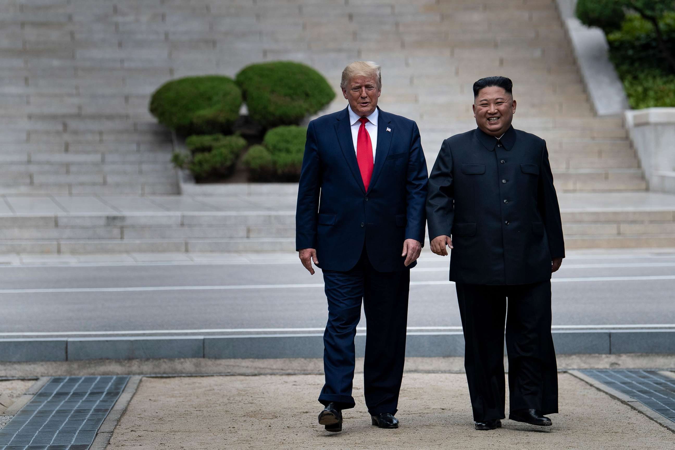 PHOTO: President Donald Trump and North Korea's leader Kim Jong-un walk on North Korean soil toward South Korea in the Demilitarized Zone on June 30, 2019, in Panmunjom, Korea.