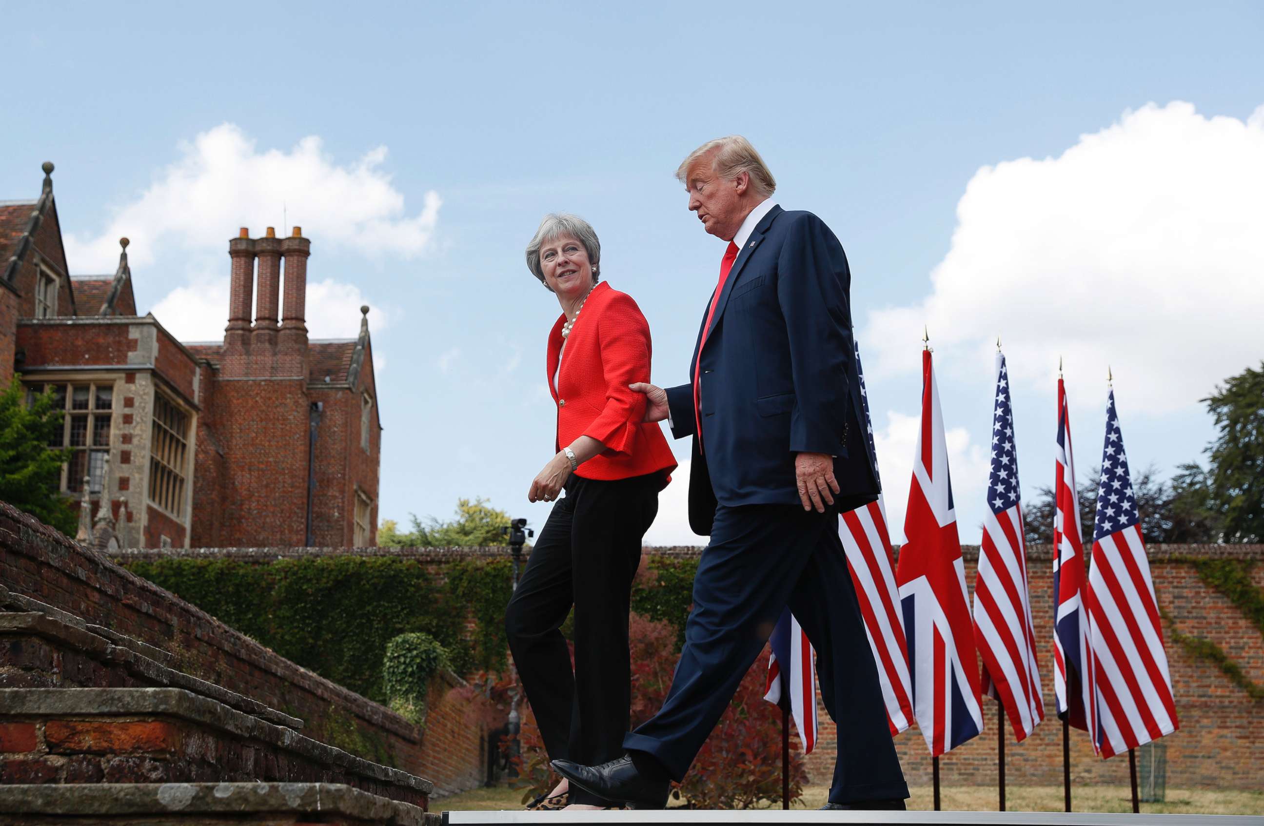 PHOTO: President Donald Trump walks with British Prime Minister Theresa May at the conclusion of their joint news conference at Chequers, in Buckinghamshire, England, July 13, 2018.