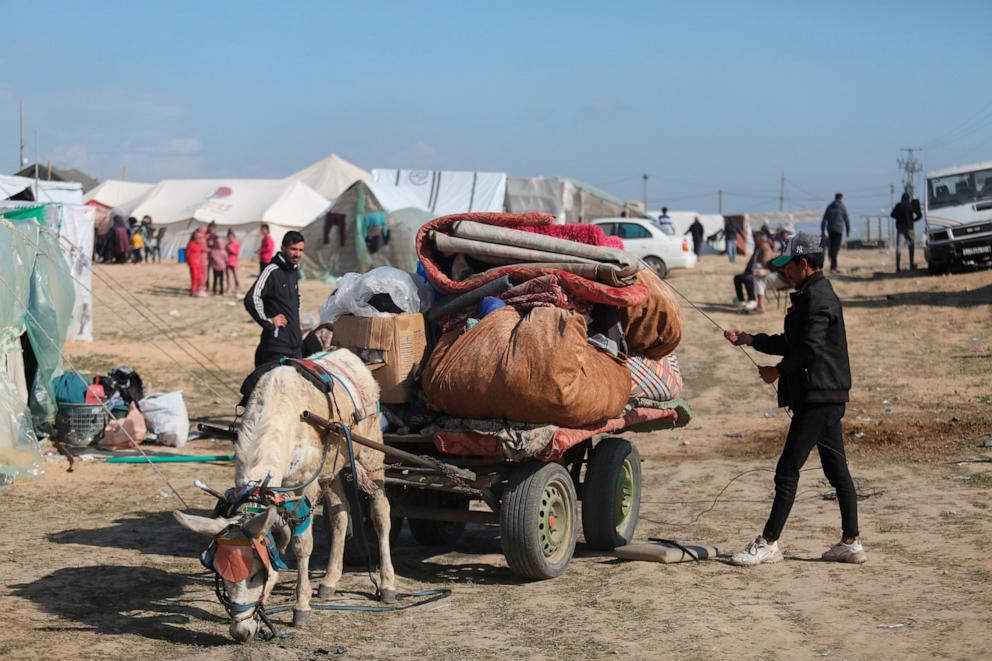 PHOTO: A Palestinian displaced by Israeli air and ground offensive on the Gaza Strip arrives at a temporary tent camp near Kerem Shalom crossing in Rafah, Sunday, Jan. 14, 2024.