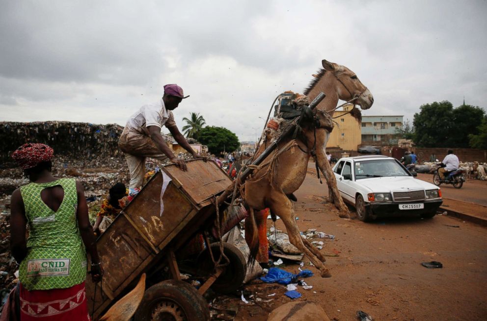 PHOTO: A waste picker unloads garbage at a waste transfer station in Bamako, Mali, Aug. 19, 2018.