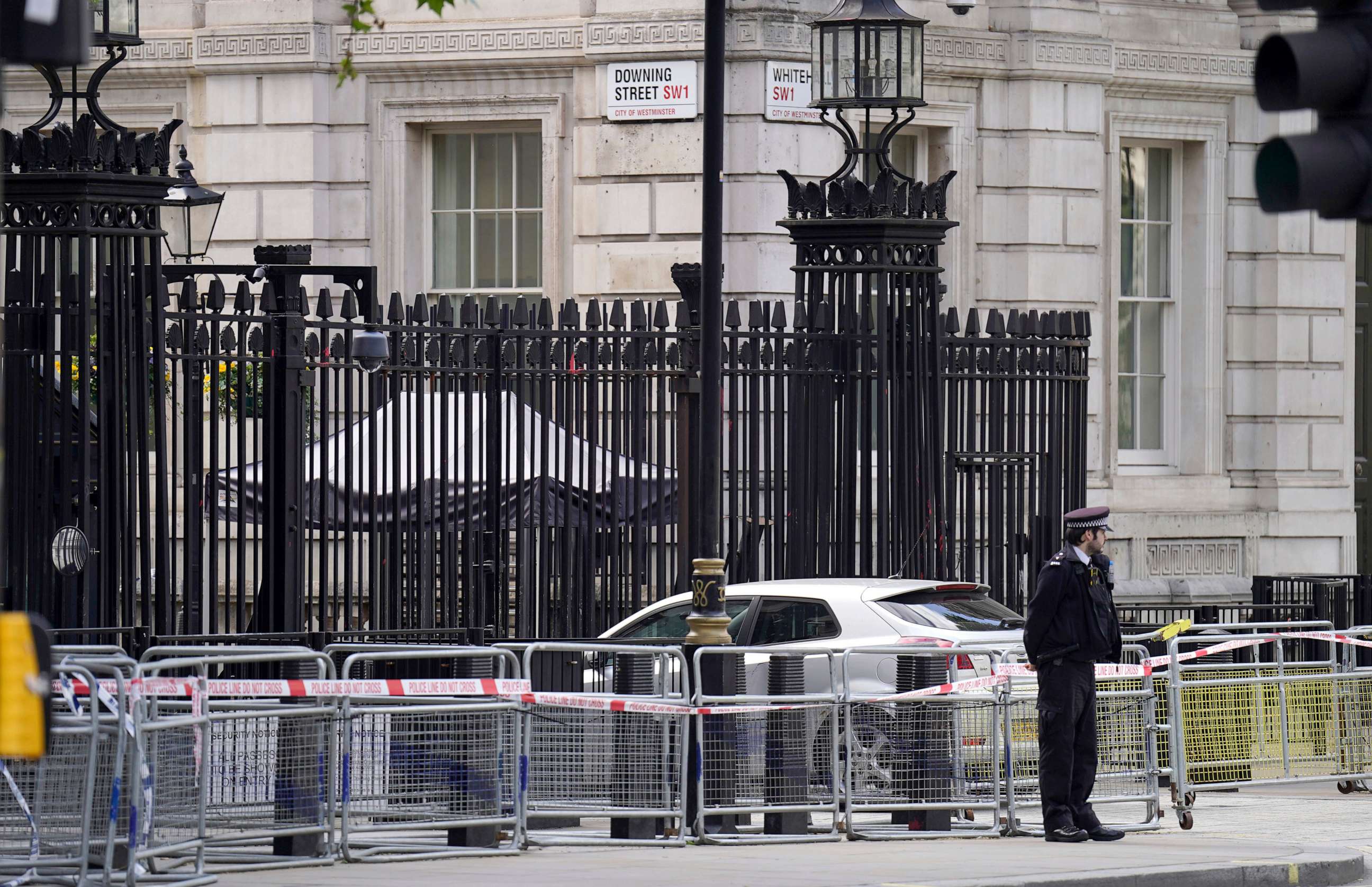 PHOTO: Police at the scene after a car collided with the gates of Downing Street in London, May 25, 2023.