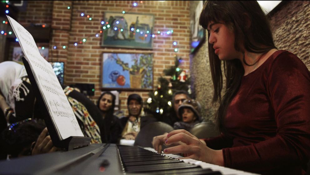 PHOTO: Parnian Hamidi, 13, a former staff member at the Downtism Cafe, in Tehran, Iran, performs at a concert held at the cafe, on Dec. 13, 2018.