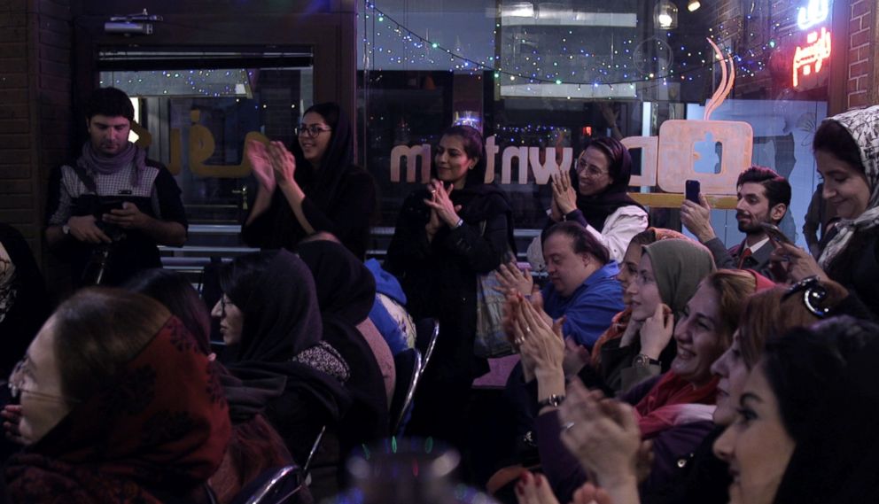 PHOTO: Audience members clap during a concert at the Downtism Cafe, in Tehran, Iran, as performers with special needs play piano, on Dec. 13, 2018.